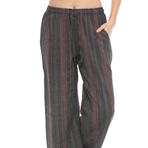 May include: Wide-leg pants with a striped pattern in shades of black, blue, and purple. The pants have a drawstring waistband and side pockets.