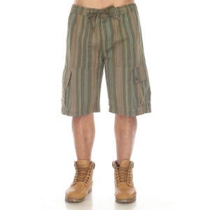 May include: Green, brown, and blue striped cargo shorts with a drawstring waist. The shorts have two side pockets and are worn with tan work boots. The shorts are knee-length and made of a lightweight fabric.