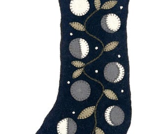 Felt Celestial Holiday Stockings,cosmic and moon cycle designs, boho Christmas decor, handcrafted sun and moon motifs, starry night theme