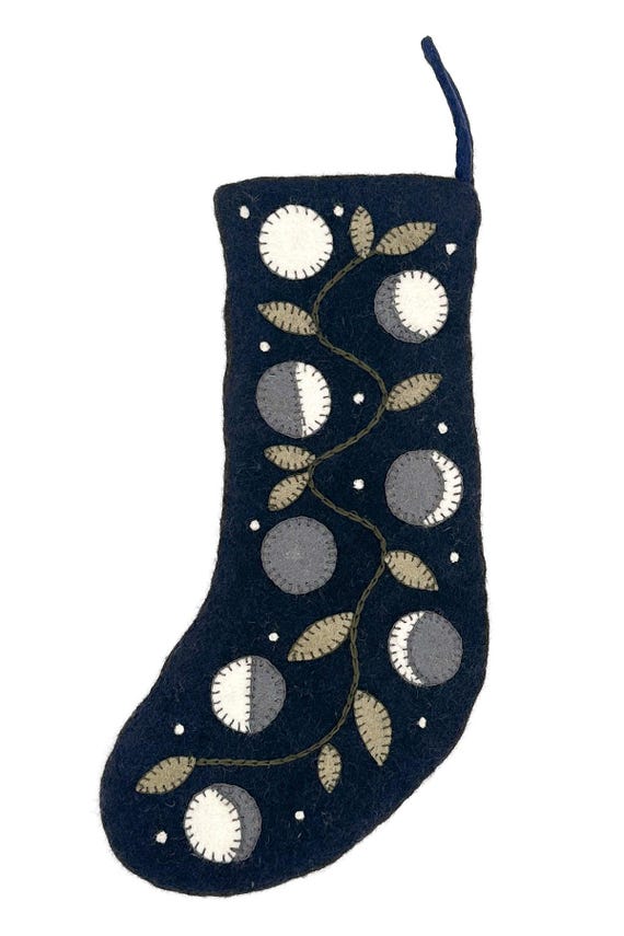 Felt Celestial Holiday Stockings,cosmic and moon cycle designs, boho Christmas decor, handcrafted sun and moon motifs, starry night theme
