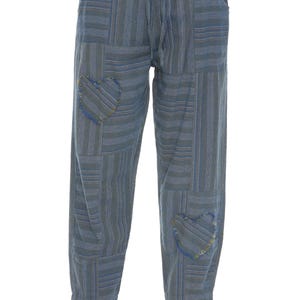 May include: Blue and gray striped patchwork pants with heart-shaped patches. The pants have a drawstring waist and pockets. The fabric appears to be a soft, lightweight material, suitable for casual wear.