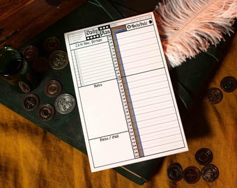 May include: A white daily planner with a black and white "Daily Plan" heading and a black and white "Schedule" heading. The planner has sections for "To be done, Perhaps", "Notes", and "Focus / Goal". The planner has a colorful time schedule on the right side.
