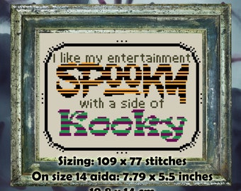 Puede incluir: Arte de punto de cruz en un marco de madera envejecida. El diseño presenta el texto "I like my entertainment SPOOKY with a side of Kooky" en negro, naranja, verde y morado. Mide 19,8 x 14 cm.