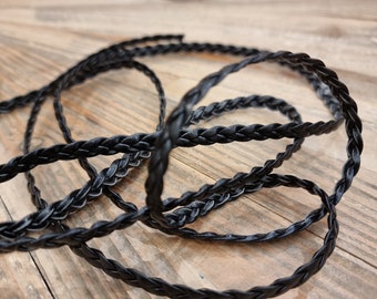 Braided cord in black faux leather of very good quality, sold by the meter