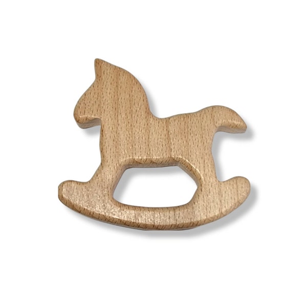 Untreated wooden teething ring, rocking horse