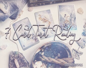 May include: A 7 Card Tarot Reading spread with three cards visible. The cards are from a deck with a white background and illustrations of fairies and nature. The cards are on a white surface with crystals and a woven bundle of sage.