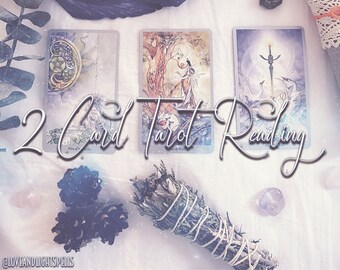 May include: A 2 Card Tarot Reading is displayed with three tarot cards, sage bundle, and crystals. The cards feature illustrations of figures and symbols. The text "2 Card Tarot Reading" is written in a cursive font. The image has a soft, ethereal aesthetic.