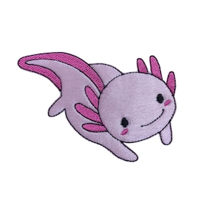 May include: An embroidered axolotl patch in pink and purple, with a smiling face. The axolotl has a pink tail and pink frills around its head.