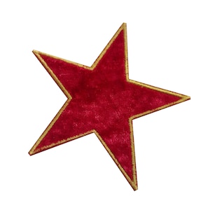 May include: A five-pointed star patch featuring a deep red velvet-like texture on the surface. The edges of the star are finished with a metallic gold thread border that provides a distinct outline against the red centre of the star shape.