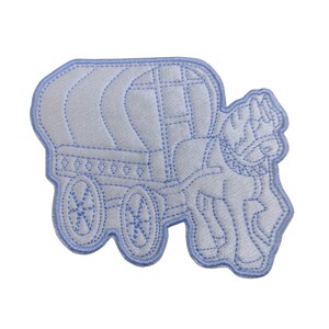 May include: A blue embroidered patch depicting a white wagon being pulled by a horse. The wagon has a rounded top and wheels with spokes. The horse has a flowing mane and tail.
