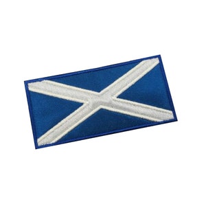 May include: An embroidered patch featuring the Scottish flag, a white saltire on a blue background.