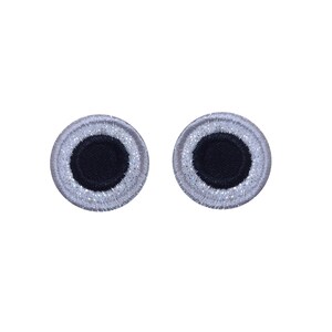 May include: Two white googly eyes with black pupils. The eyes are round and have a white border.