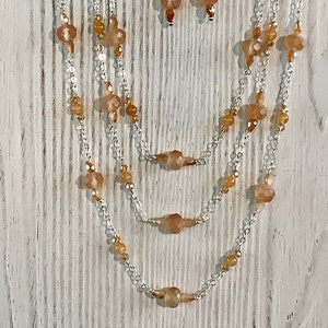 Matte peach moonstone, tangerine quartz, Chinese crystals, silver-plated chain w/ matching earrings—June birthstone—51"--N273