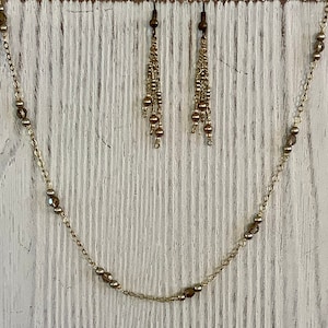 Swarovski crystals, Swarovski pearls, gold plated chain w/ matching earrings—N382