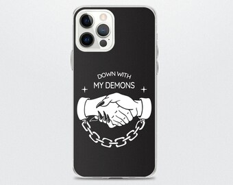 May include: Black iPhone case with a white design of two hands shaking, one with claws. The text "DOWN WITH MY DEMONS" is above the hands.