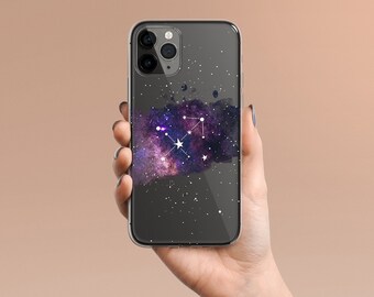 May include: A clear phone case with a galaxy and constellation design. The constellation is Sagittarius, and the galaxy is a watercolor-like purple and blue.