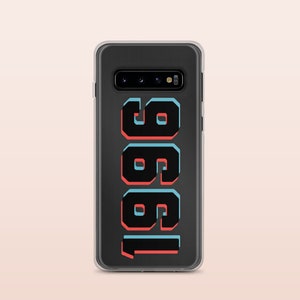 May include: A clear phone case with a black background and the number "1981" printed in black with red and blue outlines.