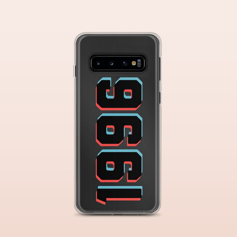 May include: A clear phone case with a black background and the number "1981" printed in black with red and blue outlines.