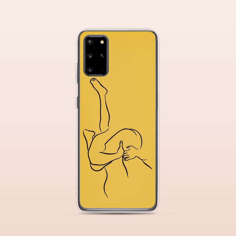May include: A yellow phone case with a black line drawing of two people embracing.