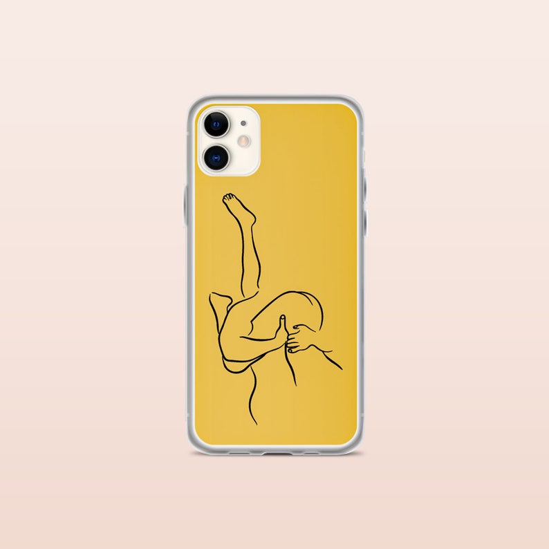 May include: A clear phone case with a yellow background and a black line drawing of two figures embracing.