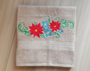 Beige terry towel with embroidery Christmas flower. A gift for Christmas for your favorite friends.
