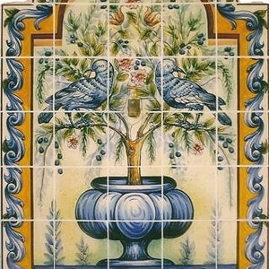 May include: A decorative ceramic tile panel depicting a tree with two blue birds. The tree is in a blue vase. The tile has a yellow and blue border with floral and scroll designs. The panel is made of several tiles.
