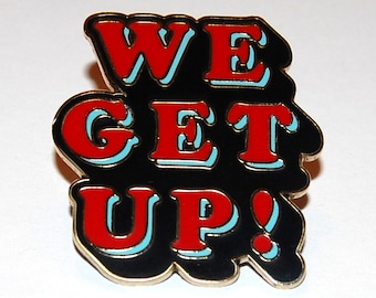We Get Up enamel pin