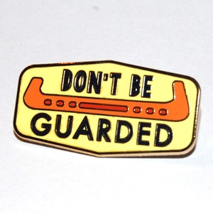 Don’t Be Guarded lapel pin for figure skaters