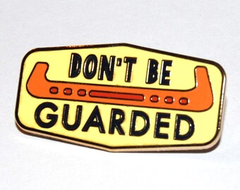 Don’t Be Guarded lapel pin for figure skaters