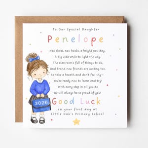 May include: A square greeting card with a brown envelope featuring a watercolor illustration of a child in a blue school uniform holding a blue bag labeled 2026. The text reads To Our Special Daughter Penelope, a poem, and Good Luck on your first day at Little Oak's Primary School with colorful stars.