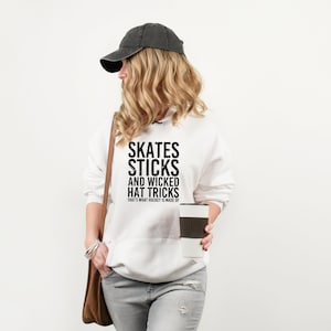 Hockey Moms SVG: Dynamic design featuring proud moms in team colors, hockey sticks in hand, radiating support and enthusiasm. Celebrate the unwavering dedication and spirit of hockey moms in this vibrant and energetic SVG