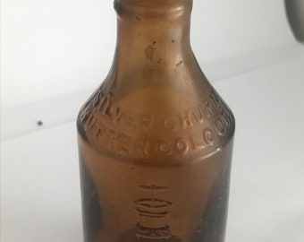 A Pictorial brown Victorian bottle