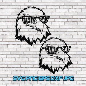 Puede incluir: Gráfico en blanco y negro de dos cabezas de águila con gafas de sol. Las gafas de sol del águila superior dicen "FIELD DAY", y las del águila inferior dicen "GAME DAY". La imagen incluye el texto "SVG PNG EPS DXF JPG".