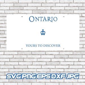 May include: A white rectangular sign displaying "Ontario" in blue, a crown symbol, and the words "Yours to Discover." The sign is fixed to a white brick wall.