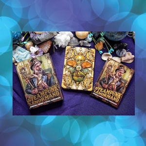 May include: Three tarot decks with a steampunk theme. The decks are titled "Steampunk Lenormand" and feature illustrations of a man in a top hat, a clockwork butterfly, and a woman with a clockwork arm.