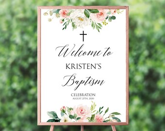 May include: White sign with a floral border and a black cross at the top. The text reads "Welcome to Kristen's Baptism Celebration August 27th, 2020".