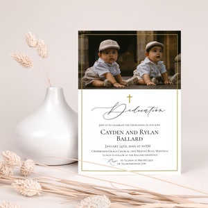 May include: A white card with gold trim and a black cross at the top. The card reads "Dedication" in cursive script. Below the cross, there is a photo of two twin boys in white shirts and hats. The text below the photo reads "Join us to celebrate the dedication of our sons Cayden and Rylan Ballard January 24th, 20XX at 10:00 AM Crossroads Grace Church, 1503 Moffat Blvd, Manteca Lunch to follow at the Ballard residence RSVP to Allison at 890-997-3451 or allison@email.com"