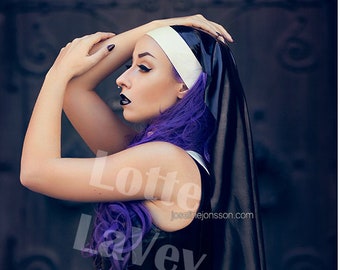 Photo print of model Lotte LaVey in latex nun outfit and white stockings