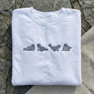 Embroidered Seal Sweatshirt, Cute Seal Evolution Hoodie, Marine Animal Lover Gift, Minimalist Ocean Crewneck, Kawaii Sea Lion Embroidery