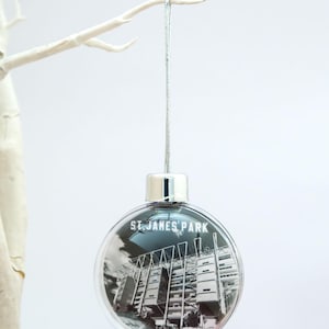 Newcastle Double Sided Round Plastic Christmas bauble St. James’ Park Stadium and Strawberry Pub. Newcastle United FC. NUFC