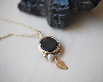 Dainty Onyx gemstone  warped in 14k gold filled wire with a small fresh water pearl and 14k gold filled leaf necklace