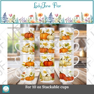 Pode incluir: Canecas brancas empilháveis com tema de outono. Cada caneca apresenta um design de abóboras laranja e brancas, folhas de outono e cabaças. As canecas são rotuladas "For 10 oz Stackable cups" e a marca "LadyJane Flair" está no topo.