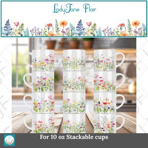 May include: White stackable coffee mugs with a floral design. The mugs are decorated with colorful wildflowers and greenery. The text "LadyJane Flair" is at the top, and "For 10 oz Stackable cups" is at the bottom.