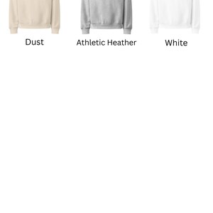 May include: Three crewneck sweatshirts in different colors: dust, athletic heather, and white. Each sweatshirt has the text "I'm not anti-social, I'm just pro-indoors." printed on the front in black.