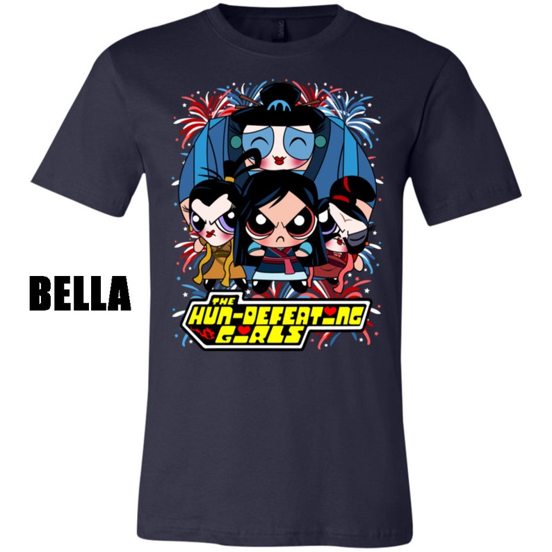 May include: Navy blue t-shirt with a graphic of four cartoon girls with red, white, and blue fireworks in the background. The text "The Hun-Defeating Girls" is printed in yellow with a red heart.