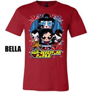 May include: Red t-shirt with a cartoon image of four girls in traditional Chinese clothing. The girls are surrounded by fireworks and the text "The Hun-Defeating Girls" is printed below them.