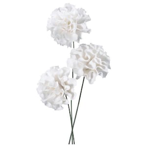 May include: Three white artificial flowers with ruffled petals and dark green stems. The flowers are clustered together, creating a full, textured appearance. The image is set against a plain white background.