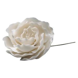 May include: A large, ivory-colored artificial rose with multiple ruffled petals. The flower has a detailed center and a thin, green stem extending to the right. The rose is set against a plain white background, highlighting its delicate texture.