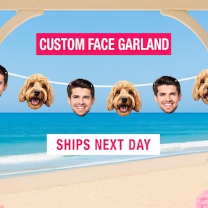 May include: A custom face garland featuring alternating cutouts of a man's smiling face and a golden-colored dog's face strung along a white ribbon. The text CUSTOM FACE GARLAND is displayed in a pink box above the garland, and SHIPS NEXT DAY is below.