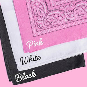 May include: Three bandanas stacked on top of each other. The top bandana is pink with a white paisley pattern. The middle bandana is white. The bottom bandana is black. The bandanas are labeled "Pink", "White", and "Black" in white text.
